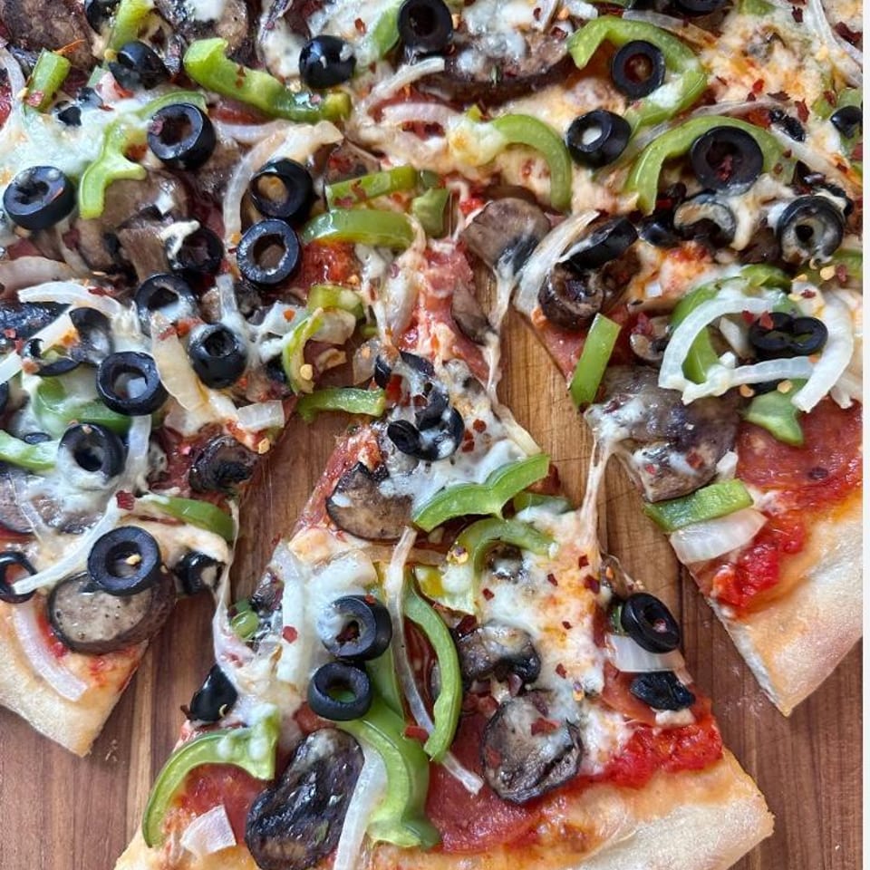 Indulge in Our Supreme Pizza