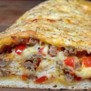 FAMILY STYLE SAUSAGE & PEPPER STROMBOLI